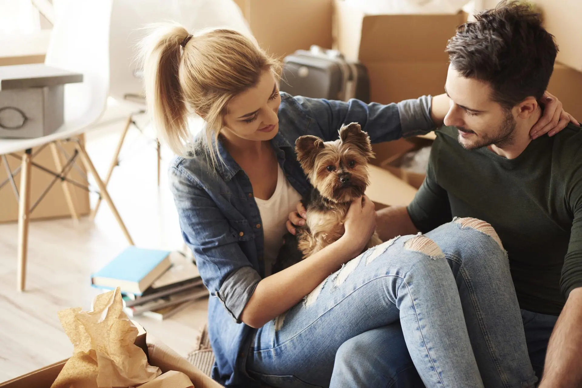 couple-with-dog-and-moving-boxes